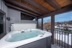 Take in the Whitefish River views from your private hot tub.
